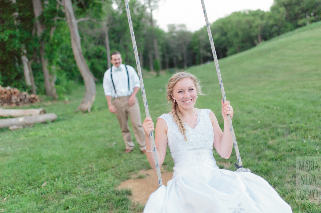 Bride and groom on rope swing