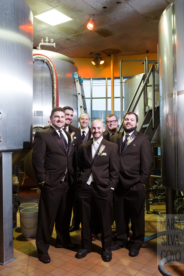Groom and groomsmen by the brewery tanks