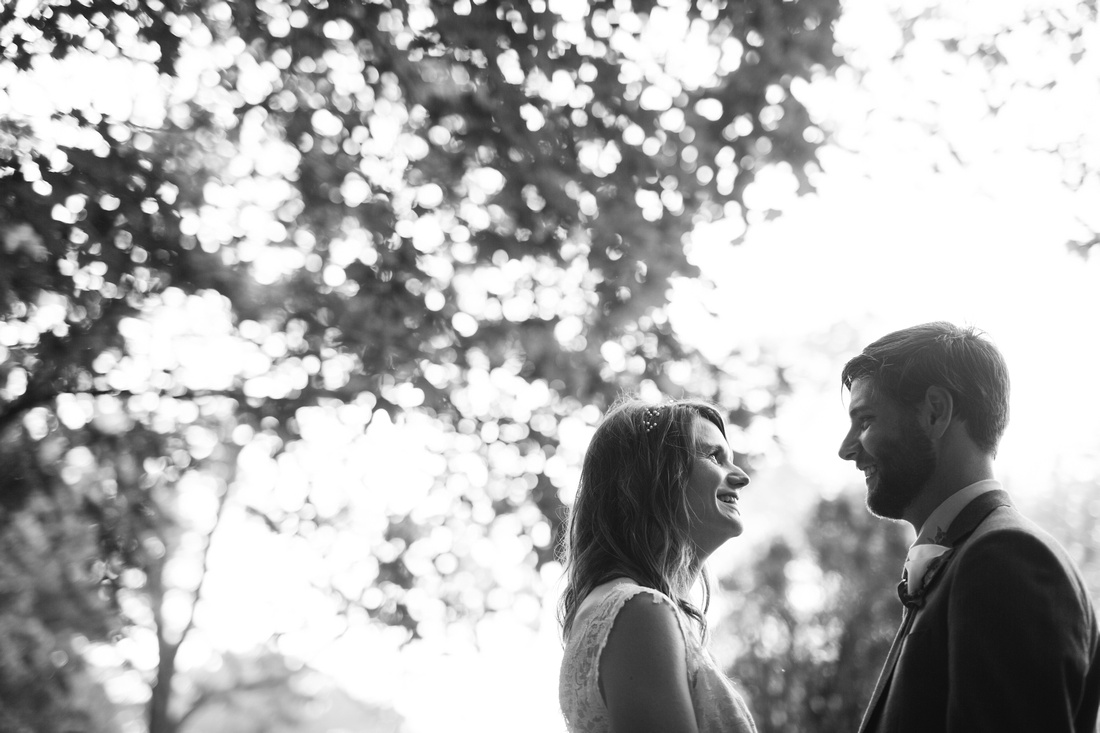 Bride and groom portrait by the trees