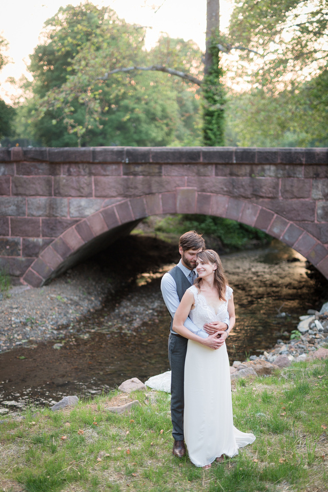Bride and groom by the creek at the Cornwall Inn
