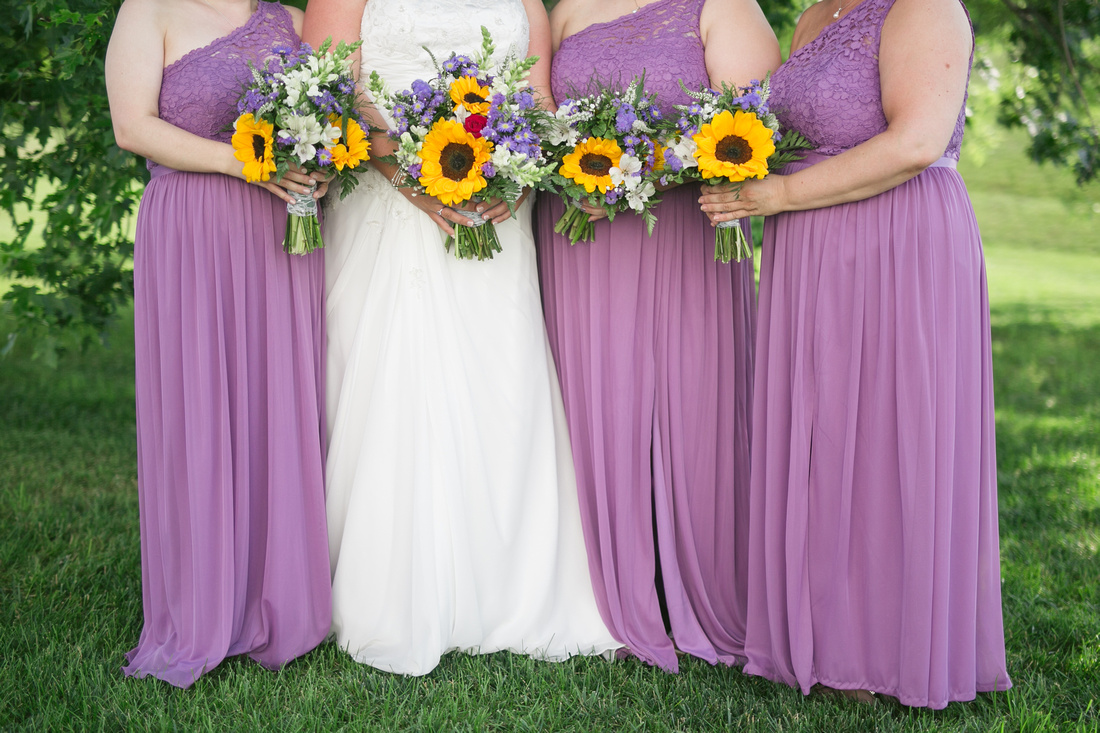 Lilac bridesmaids with sunflower bouquets at Stoltzfus Homestead