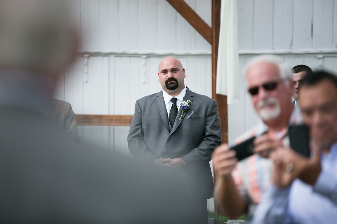 Groom looking at the bride at Stoltzfus Homestead