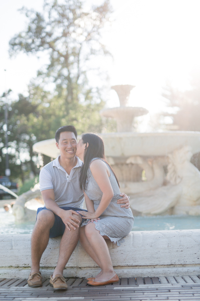 Engagement photo at a fountain by the Philadelphia museum of art