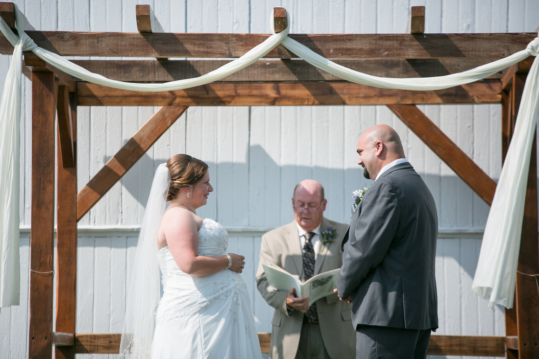 Bride and groom during ceremony at Stoltzfus Homestead