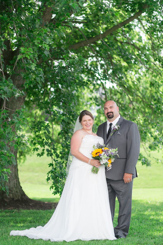 Bride and groom by the tree at Stoltzfus Homestead