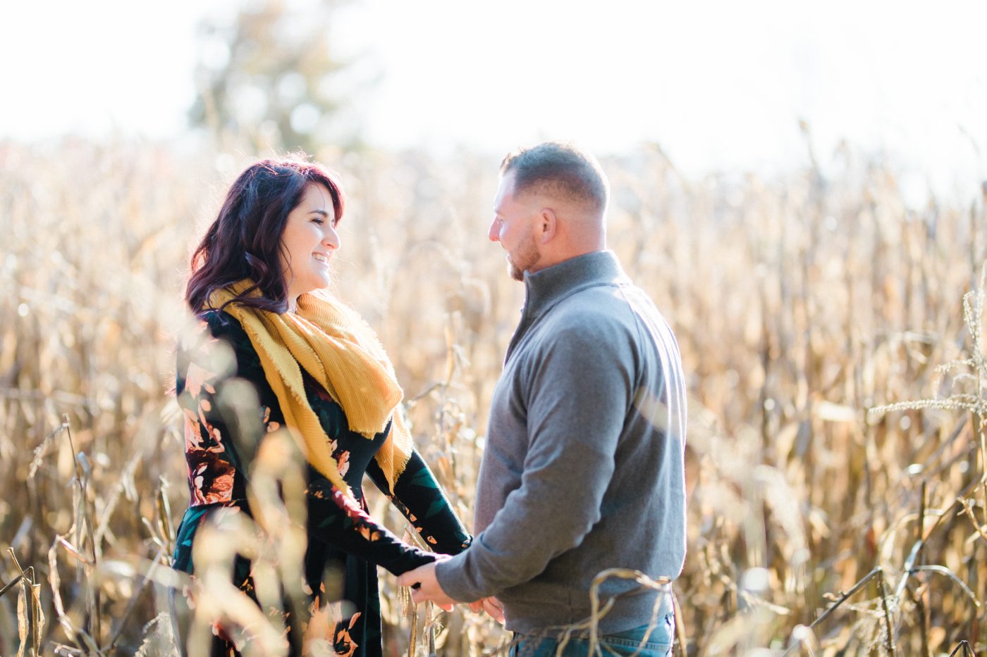 Couple holding hands on a field at Codorus State Park