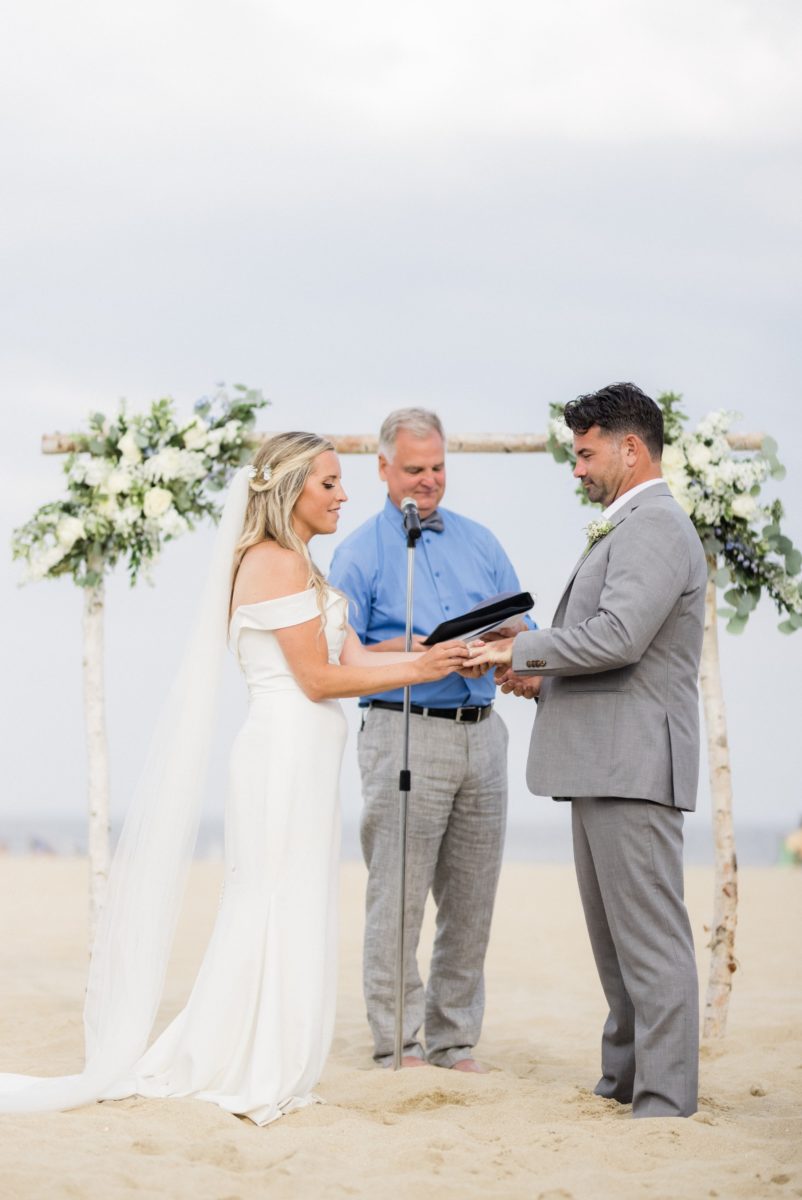 Ring exchage during beach ceremony at the Taylor Pavilion in Belmar NJ
