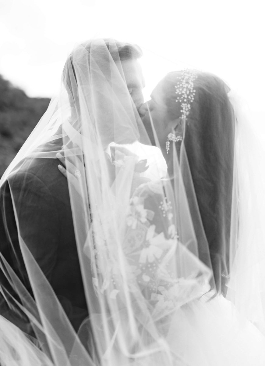 Bride and groom veil photo in black and white
