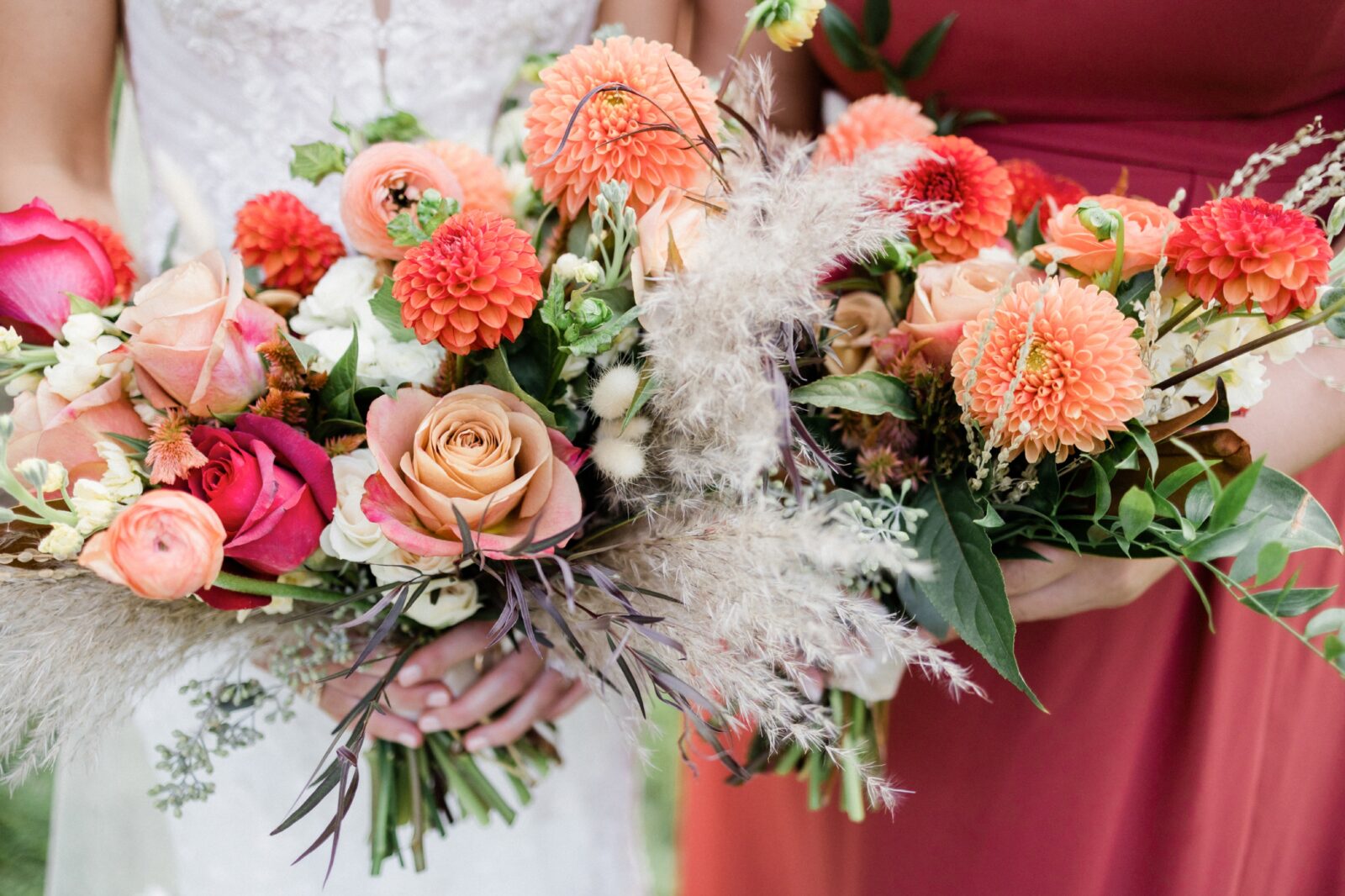 Detail of bride and bridesmaids bouquets with shades of coral