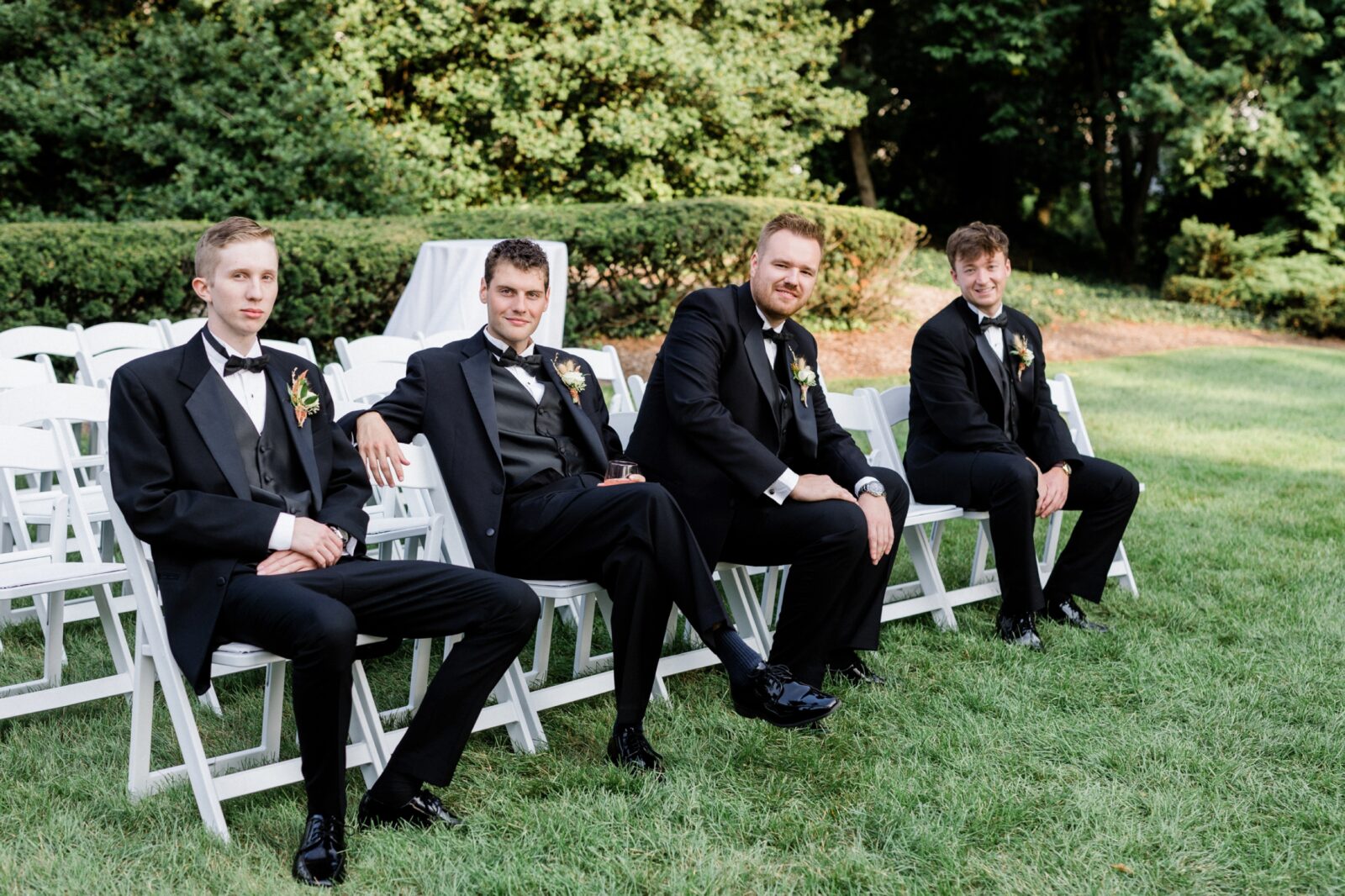 Groomsmen hanging out during photos at Box Hill Mansion
