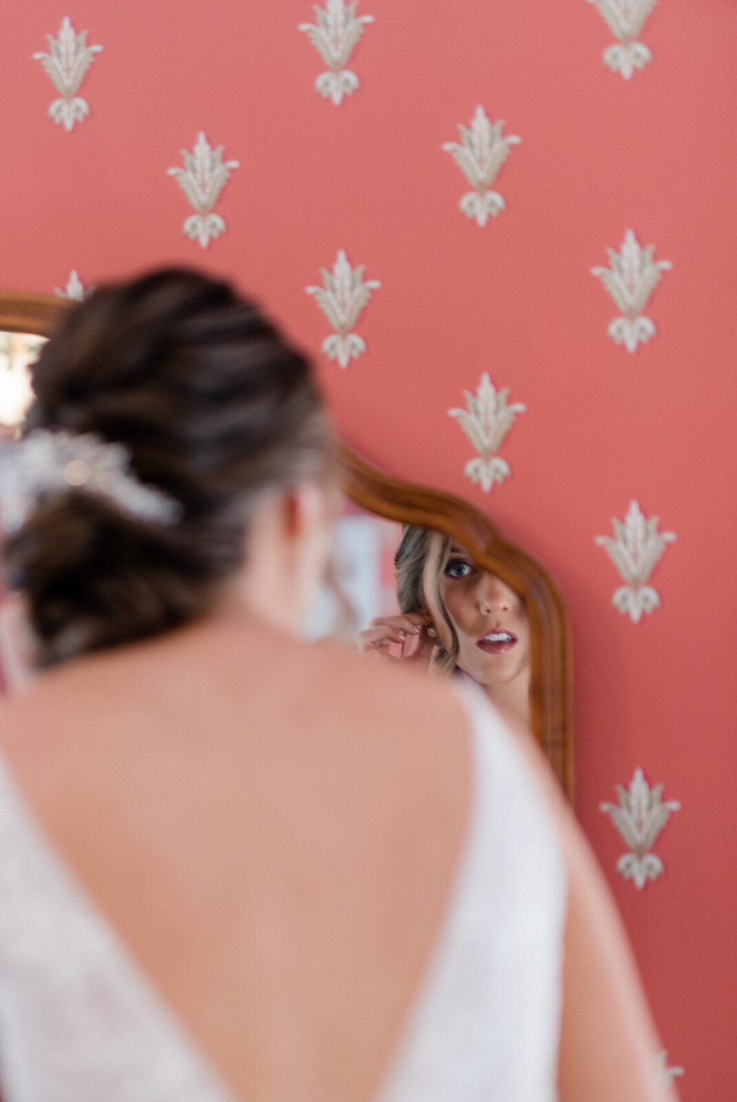 Bride looking in the mirror getting ready inside the Box Hill Mansion photographed by Maria Silva-Goyo Photography