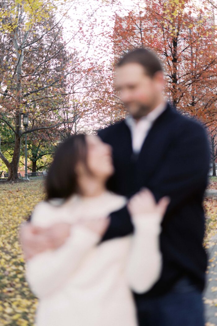 fall folliage in downtown harrisburg with out of focus couple in the foreground